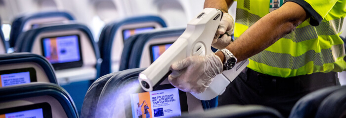 A Delta worker uses a misting gun