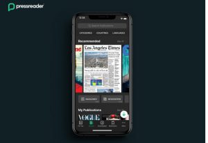 A smartphone showing the Los Angeles Times with PressReader