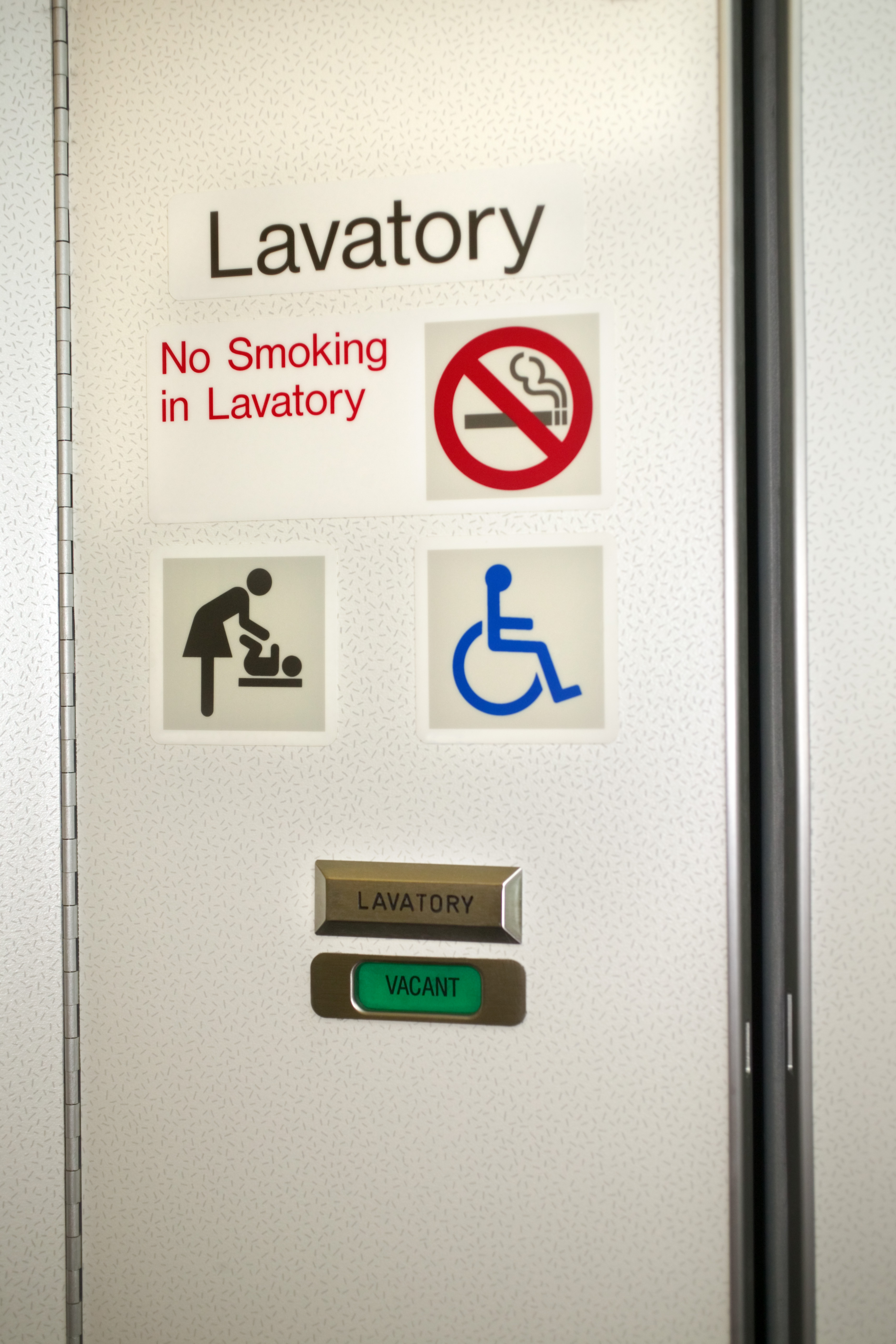 airplane lavatory door with stickers