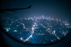 aerial view of lit up city at night