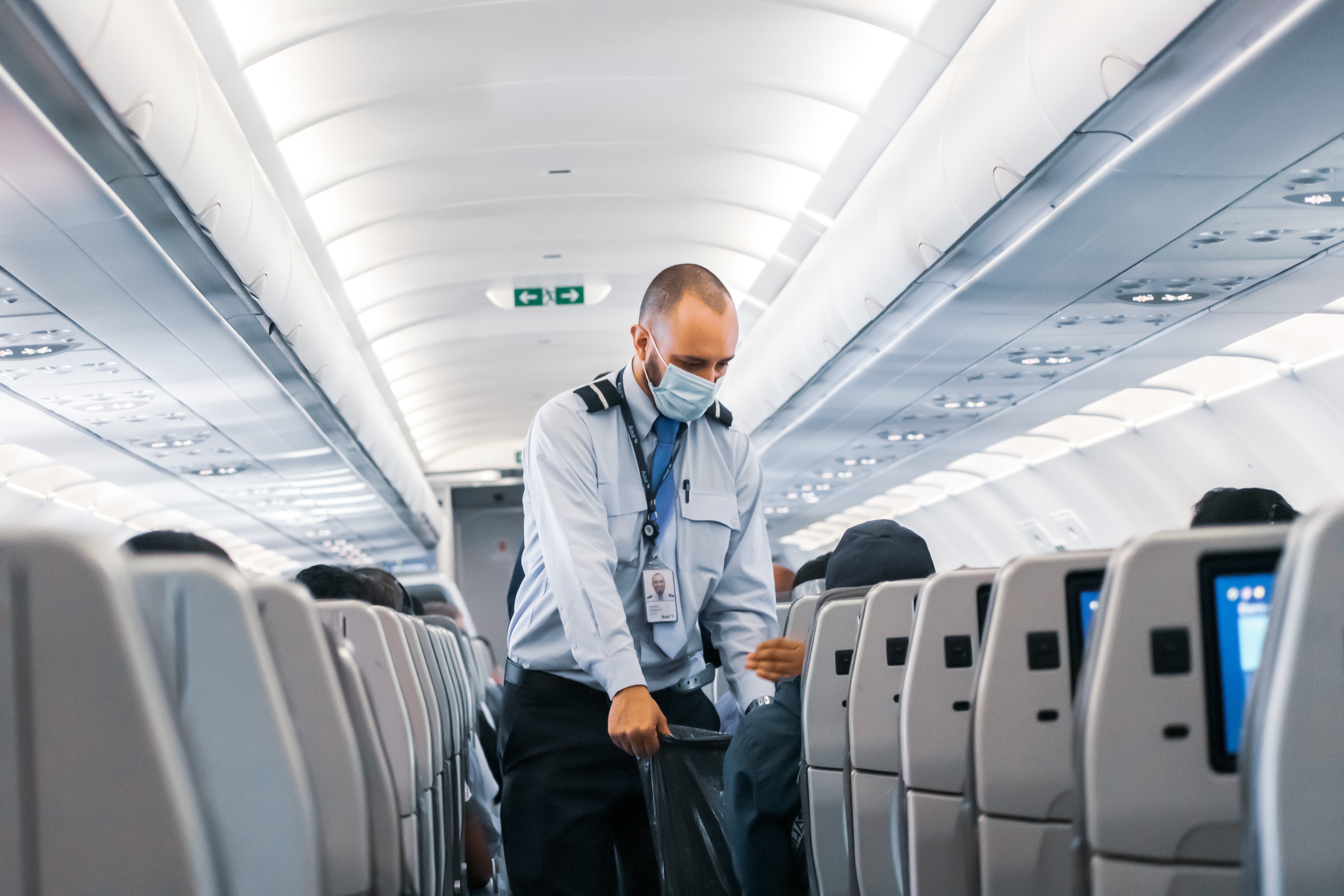 cabin attendant with recycling bag