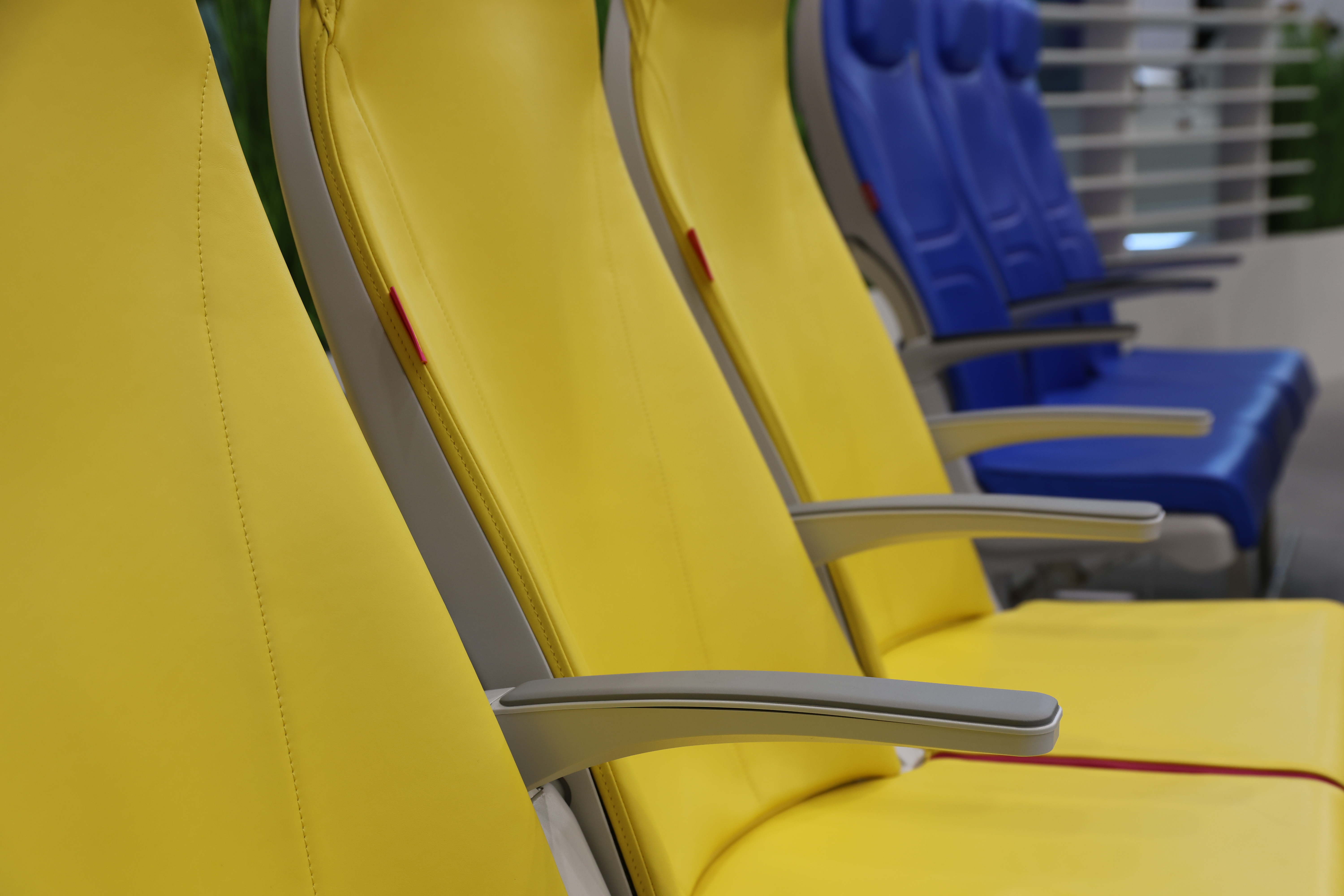 row of cream airline seats